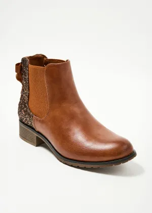 Chelsea boots with fancy heels and bow